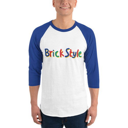 Fashionable male model wearing a white 100% cotton shirt with blue 3/4 length sleeves featuring parody AFOL slogan "Brick Style" in child-like block writing with letters alternating between blue, red, and green. Item is a BRKDrip retro collection baseball tee with a vintage building blocks aesthetic.