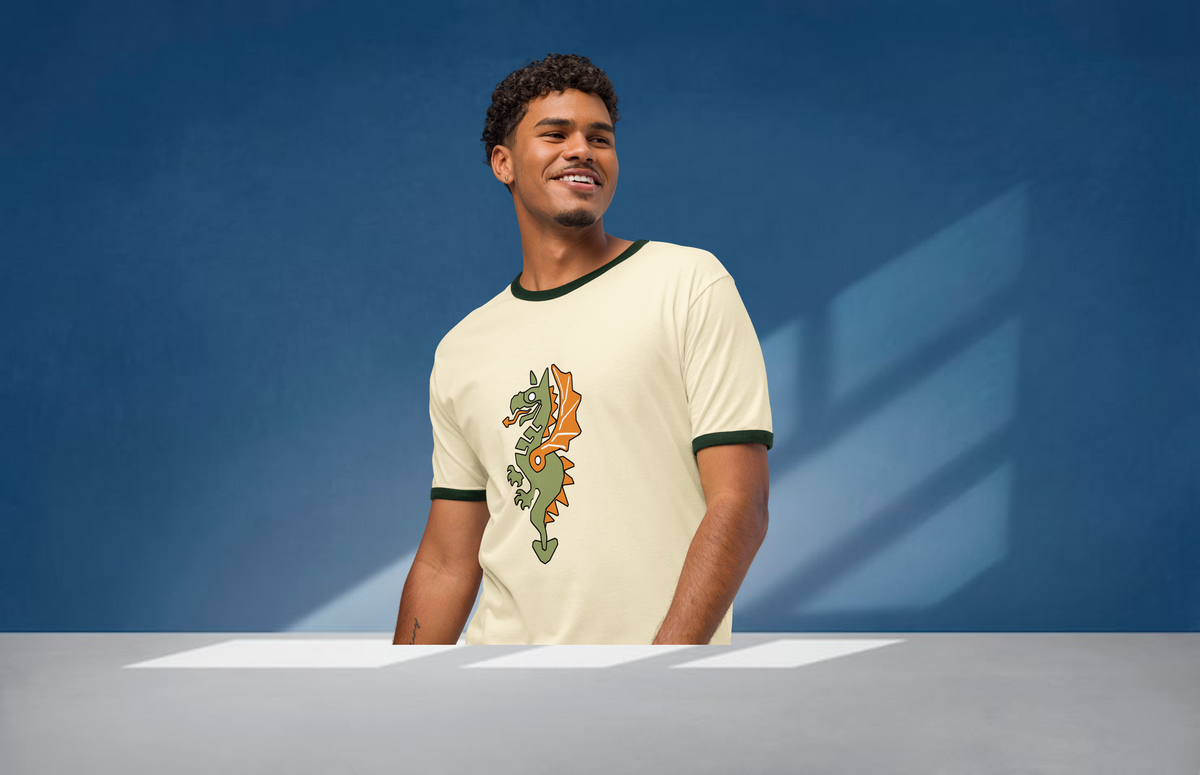 Fashionable male model wearing a natural-colored airlume cotton t-shirt featuring classic fan-made reimagined dragon masters faction design with high-contrast green ribbing on the sleeve and neck. Item is a BRKDrip Retro Collection t-shirt with a vintage castle building blocks aesthetic.