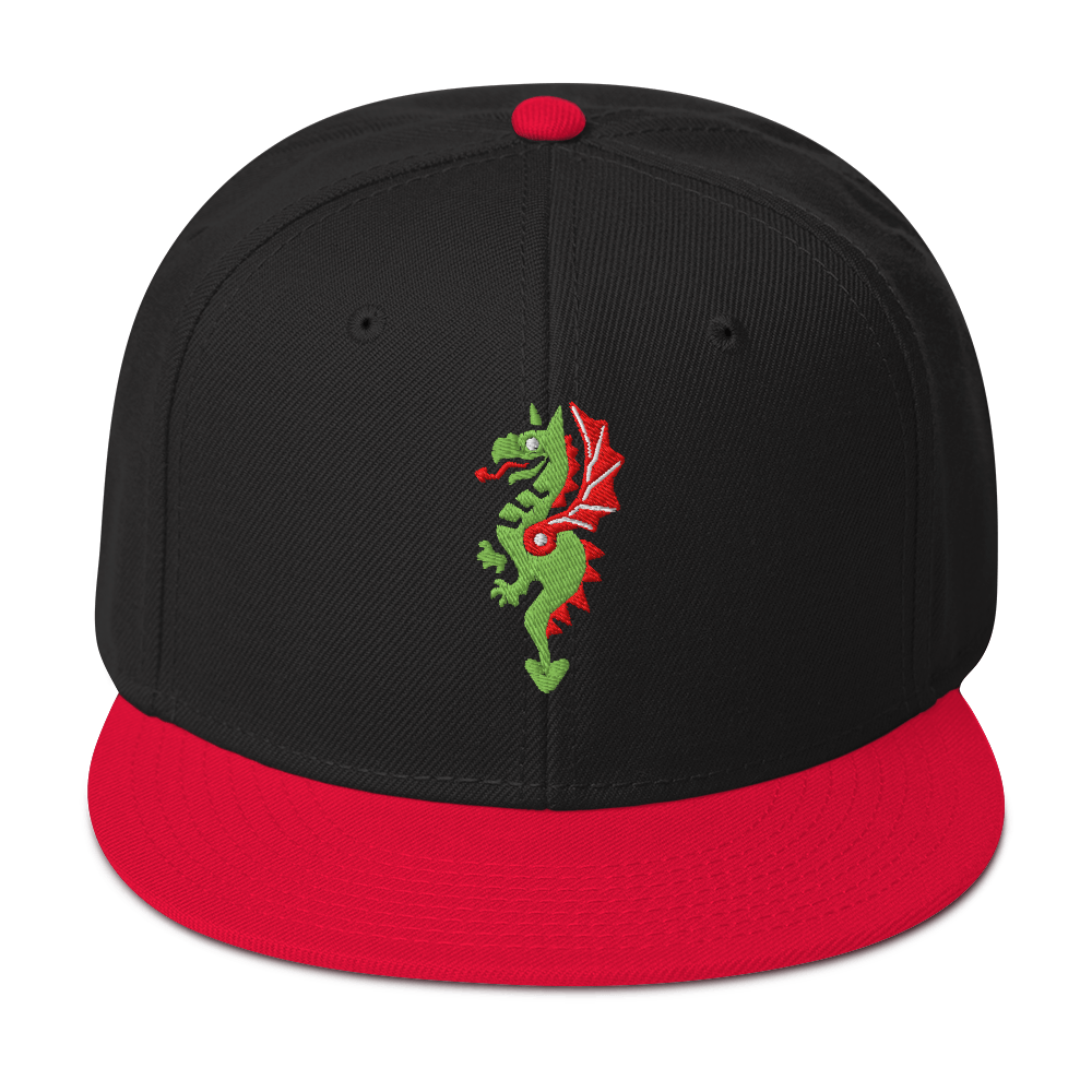 Front-facing view of black flat bill hat with a bright red bill and strap featuring embroidered dragon master remix design with matching bright red wings. Item is a BRKDrip AFOL Headgear classic snapback with a vintage castle building blocks aesthetic.