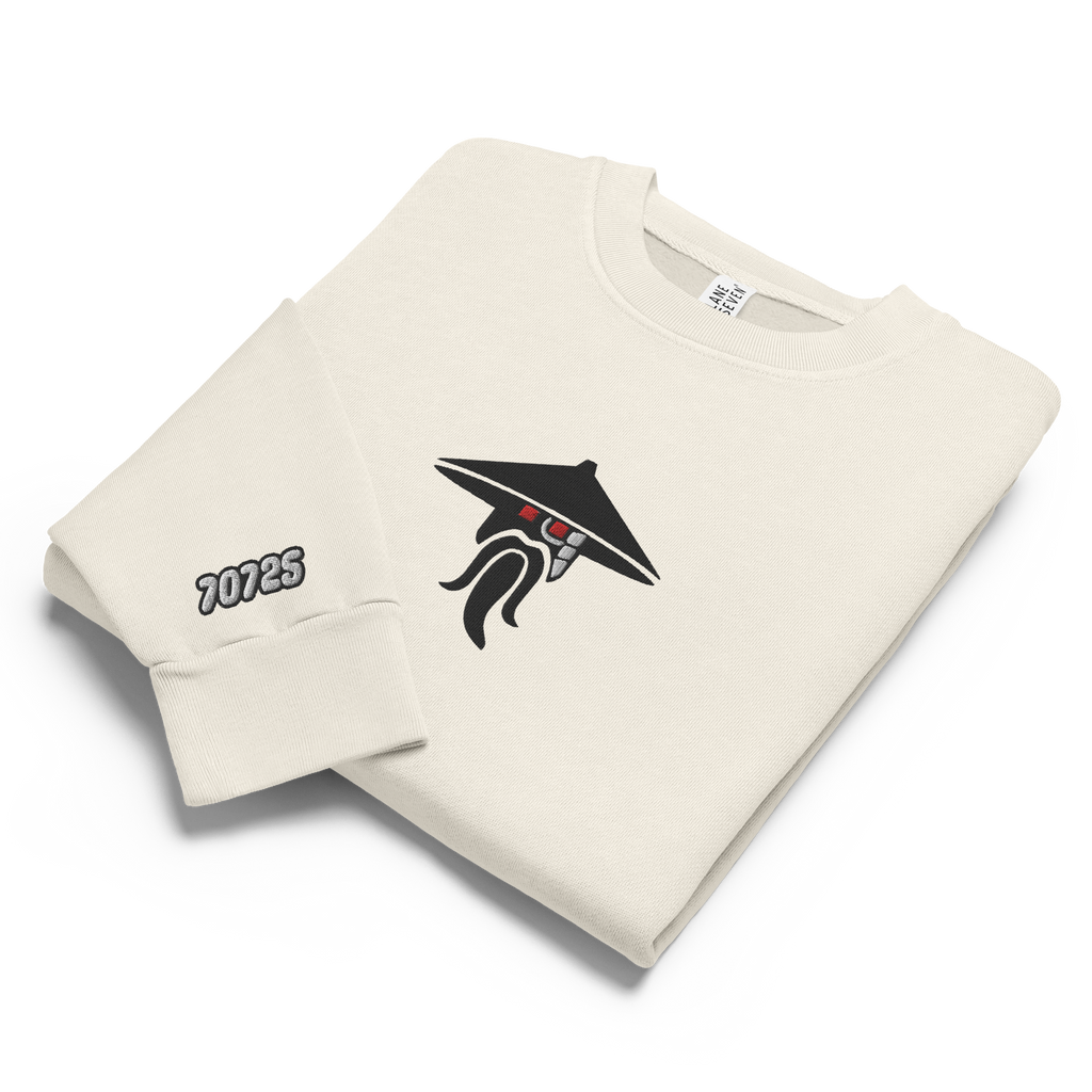 Off-white lunar rock tri-blend fleece sweatshirt featuring a classic fan-made evil sensei with red eyes design embroidered across the front and setshirt number 70725 on the sleeve. Item is a BRKDrip Limited Edition Cozy Wear Sweatshirt with a modern elemental brick master aesthetic.