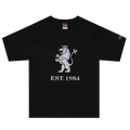 Black heavyweight, 100% cotton luxury Champion© t-shirt featuring aged lion emblem and text "EST. 1984" indicating the year the faction was first introduced to the brick universe. Item is a BRKDrip Heritage Collection luxury shirt with a vintage castle building block aesthetic.